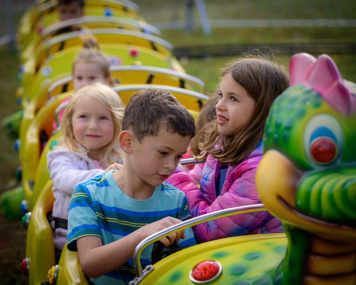Children riding a caterpillar ride