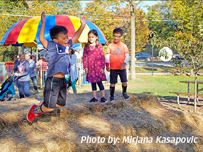Kids playing at Cosley Zoo during pumpkin fest